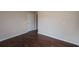 This bedroom features hardwood floors, neutral walls, and a classic interior door at 102 Peaceful Vw, Acworth, GA 30102