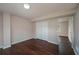 This bedroom features hardwood floors, neutral walls, and a double door closet at 102 Peaceful Vw, Acworth, GA 30102