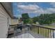 Relaxing deck offers outdoor seating, a grill, and views of the serene backyard at 102 Peaceful Vw, Acworth, GA 30102