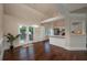 Bright dining area with hardwood floors, adjacent to kitchen and featuring French doors to outdoor deck at 102 Peaceful Vw, Acworth, GA 30102