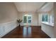 Inviting dining area with hardwood floors, French doors to the deck, and white wainscoting at 102 Peaceful Vw, Acworth, GA 30102