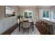 Elegant dining room with a modern table, chairs, and access to the outdoor space at 102 Peaceful Vw, Acworth, GA 30102