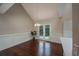 Bright dining area with french doors, hardwood floors, wainscoting, and an elegant chandelier at 102 Peaceful Vw, Acworth, GA 30102