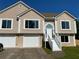 Inviting two-story home boasting large windows, an attached two-car garage and stairway entry at 102 Peaceful Vw, Acworth, GA 30102
