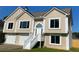 Charming two-story home featuring an inviting entryway and an attached two-car garage at 102 Peaceful Vw, Acworth, GA 30102