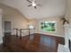 Bright living room with hardwood floors, a fireplace, and a large window offering natural light at 102 Peaceful Vw, Acworth, GA 30102