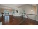 Open living space with hardwood floors, access to the kitchen, and a staircase at 102 Peaceful Vw, Acworth, GA 30102