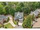 Aerial view of the home showcasing its manicured lawn, mature trees, and circular driveway at 111 Jeffrey Pl, Smyrna, GA 30082