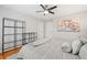 Relaxing bedroom featuring neutral paint, ceiling fan, and stylish decor above a queen bed at 111 Jeffrey Pl, Smyrna, GA 30082