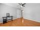 Bedroom featuring hardwood floors, with an open door to the ensuite bathroom at 111 Jeffrey Pl, Smyrna, GA 30082