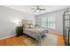 Bedroom with hardwood floors, a ceiling fan, and a large window at 111 Jeffrey Pl, Smyrna, GA 30082