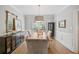 Light-filled dining room features a rustic wood table, decor, and hardwood floors at 111 Jeffrey Pl, Smyrna, GA 30082