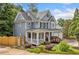 Charming home with a welcoming front porch, complemented by lush landscaping and a side entry garage at 111 Jeffrey Pl, Smyrna, GA 30082