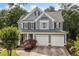Charming two-story home with a well-manicured lawn and a two-car garage at 111 Jeffrey Pl, Smyrna, GA 30082