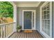 Charming front door with a wreath, decorative sidelight, and inviting 