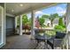 Cozy front porch with a swing, seating, and beautiful landscaping at 111 Jeffrey Pl, Smyrna, GA 30082