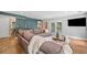 Spacious living room with hardwood floors, large sectional sofa, and access to the backyard at 111 Jeffrey Pl, Smyrna, GA 30082