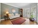 Elegant living room with hardwood floors, a stylish accent wall, and lots of natural light at 111 Jeffrey Pl, Smyrna, GA 30082