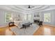 Spacious main bedroom features tray ceilings, many windows, and decorative fireplace at 111 Jeffrey Pl, Smyrna, GA 30082