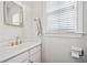 Powder room features modern fixtures and white vanity at 111 Jeffrey Pl, Smyrna, GA 30082
