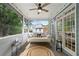 Relaxing screened porch with comfortable seating and a ceiling fan at 111 Jeffrey Pl, Smyrna, GA 30082