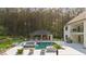 A spacious backyard featuring a pool, outdoor kitchen and entertainment area at 2400 Worth Ave, Loganville, GA 30052