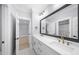 Contemporary bathroom with double vanity, large mirror, and stylish fixtures at 2400 Worth Ave, Loganville, GA 30052