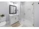 Bright bathroom featuring a glass shower, white vanity, and modern fixtures at 2400 Worth Ave, Loganville, GA 30052