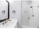 Modern bathroom featuring a glass-enclosed shower, white subway tiles and a vanity at 2400 Worth Ave, Loganville, GA 30052