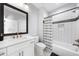 Modern bathroom with a white vanity, subway tile shower, and black hardware accents at 2400 Worth Ave, Loganville, GA 30052