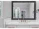 Bathroom with white cabinets, marble countertop, large mirror, and neutral paint at 2400 Worth Ave, Loganville, GA 30052