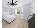 Comfortable bedroom with natural light, hardwood floors, and ceiling fan at 2400 Worth Ave, Loganville, GA 30052