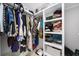 Organized closet with hanging clothes and folded items on shelves at 2400 Worth Ave, Loganville, GA 30052