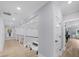 Upstairs hallway overlooking the living spaces below and featuring hardwood floors at 2400 Worth Ave, Loganville, GA 30052