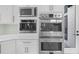 Stainless steel appliances and white cabinets for a modern kitchen appeal at 2400 Worth Ave, Loganville, GA 30052