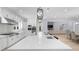 Bright kitchen featuring a large island, stainless steel appliances, and modern pendant lighting at 2400 Worth Ave, Loganville, GA 30052