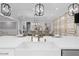 Modern kitchen with an island, farmhouse sink, and overhead lighting at 2400 Worth Ave, Loganville, GA 30052