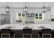 Bright kitchen featuring a large island, stainless steel appliances, and modern pendant lighting at 2400 Worth Ave, Loganville, GA 30052