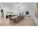 Open concept living space with hardwood floors, fireplace, and adjacent dining area at 2400 Worth Ave, Loganville, GA 30052