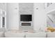 Bright living room featuring fireplace, high ceilings, and a comfortable sectional sofa at 2400 Worth Ave, Loganville, GA 30052