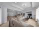Open concept living room/bedroom with neutral paint, tray ceilings and hardwood floors at 2400 Worth Ave, Loganville, GA 30052