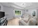 Comfortable living room showcasing hardwood floors, natural light, and stylish furniture at 2400 Worth Ave, Loganville, GA 30052