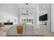 Bright, open living room with a fireplace, large windows, and plush sectional sofa at 2400 Worth Ave, Loganville, GA 30052