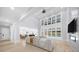Open concept living room with a fireplace, recessed lighting, and expansive windows at 2400 Worth Ave, Loganville, GA 30052