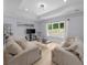 Cozy living room with lots of light, neutral paint, and tray ceilings at 2400 Worth Ave, Loganville, GA 30052