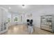 Bright home office with glass desk, wall art and hardwood flooring at 2400 Worth Ave, Loganville, GA 30052