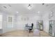 Bright home office with glass desk, wall art and hardwood flooring at 2400 Worth Ave, Loganville, GA 30052