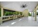 Spacious outdoor kitchen area with stainless steel grill and granite countertops at 2400 Worth Ave, Loganville, GA 30052