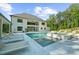 Gorgeous backyard featuring a pool, spa, patio, and outdoor lounge area for entertaining at 2400 Worth Ave, Loganville, GA 30052