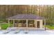 Pool house with outdoor kitchen, bathroom, and lounge chairs at 2400 Worth Ave, Loganville, GA 30052